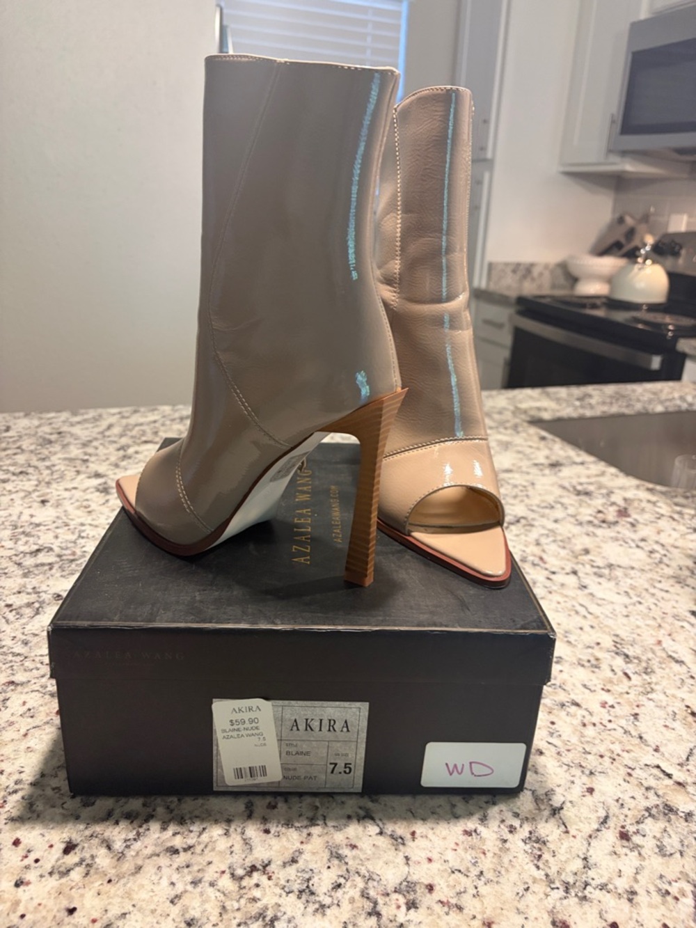 AKIRA Beige Patent Open-Toe High Heel Ankle Boots  worn inside for photoshoot